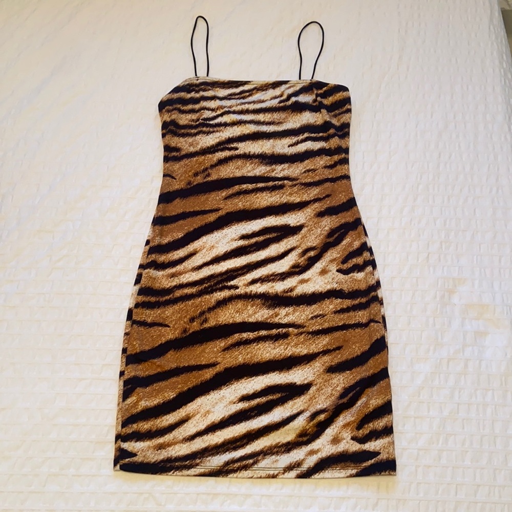 Slimming and sexy cheetah dress. Never worn.